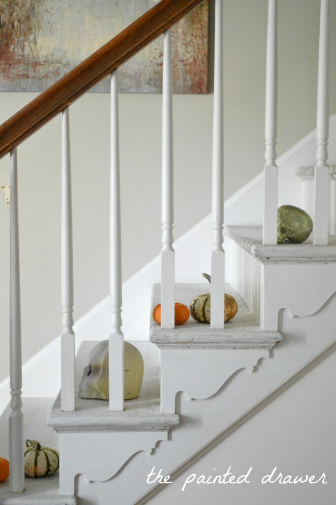 Painted Stairs in foyer www.thepainteddrawer.com