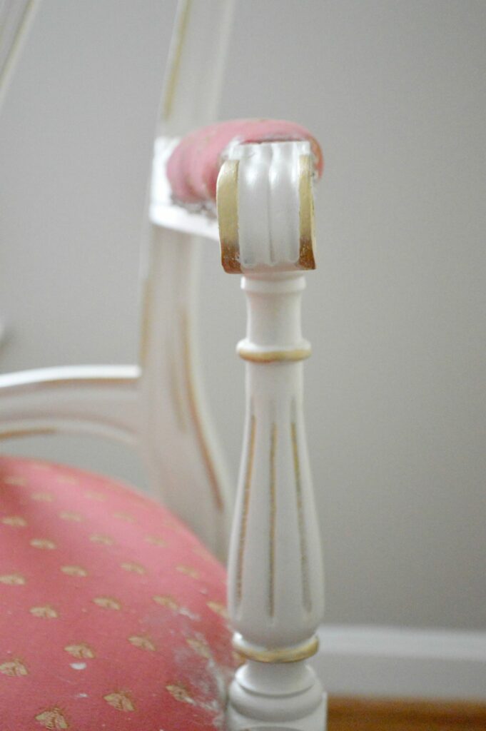 Gold Gilding wax over antique white paint on vintage french dining chair at www.thepainteddrawer.com